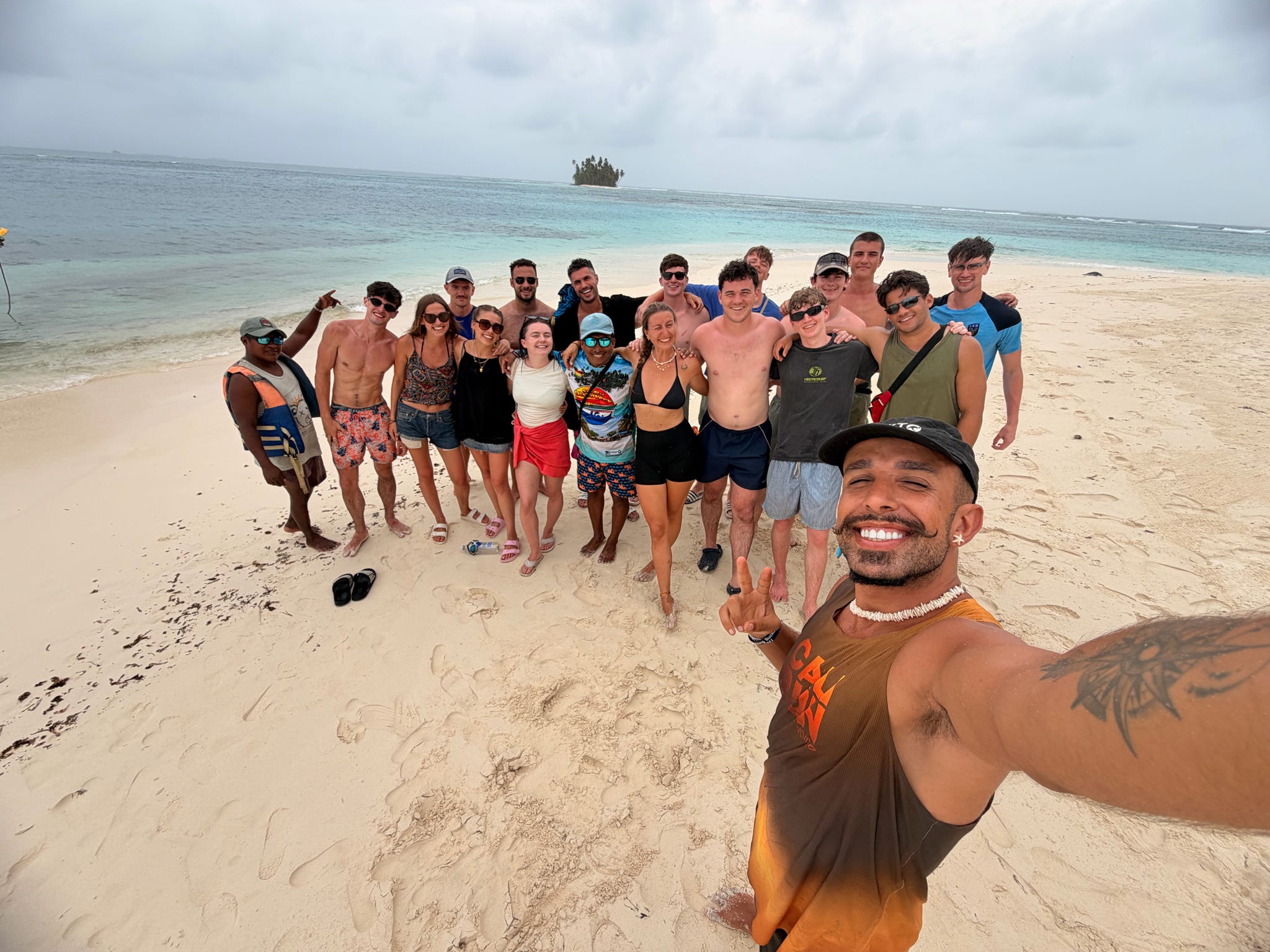 Calm turquoise water beside a palm island — no open ocean crossing